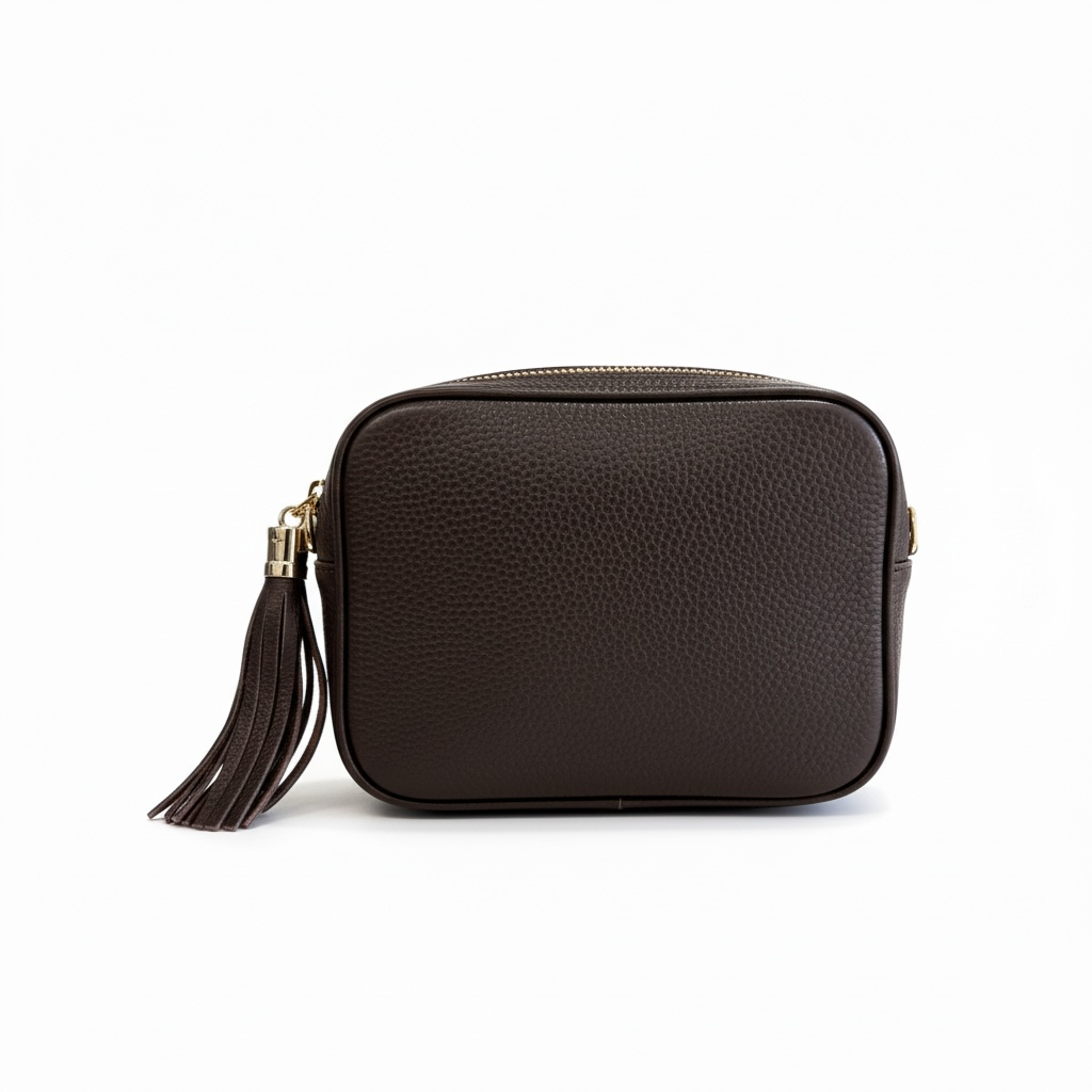 Bandolera de piel con cadena dorada y borla