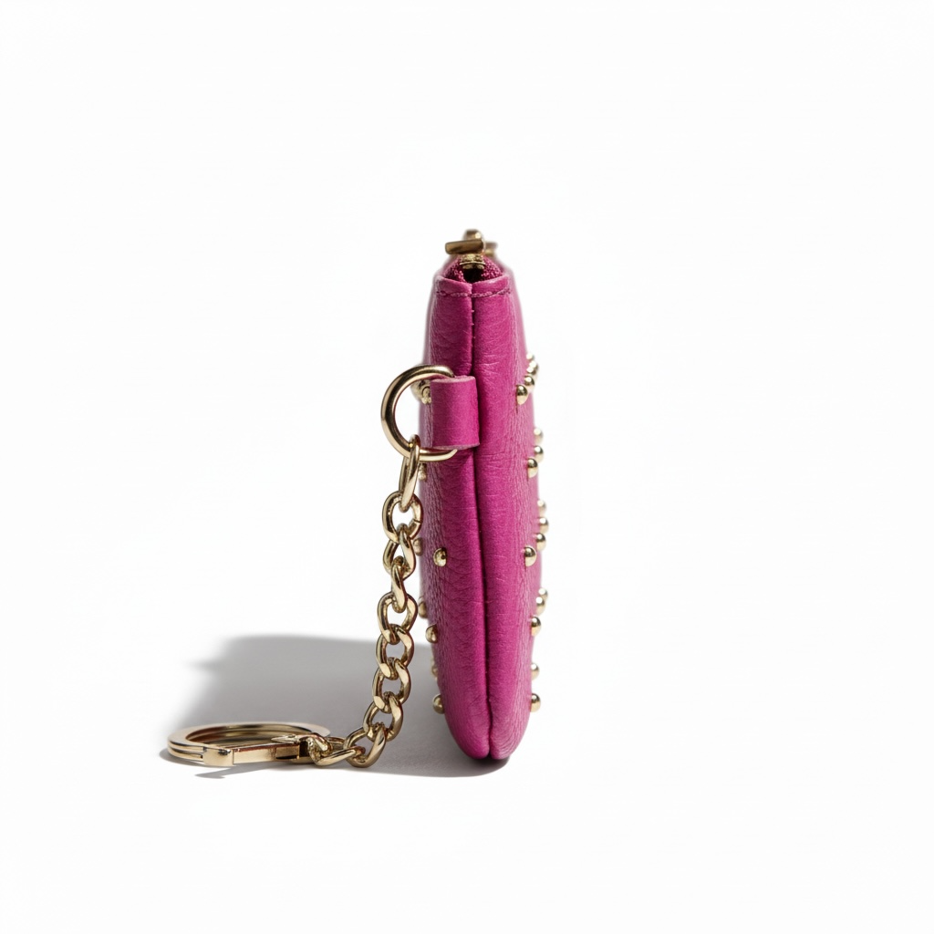 lateral del monedero monedero piel natural con tachuelas en color rosa