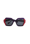 Marca noco de gafas de sol modelo bicolor morado y rojo
